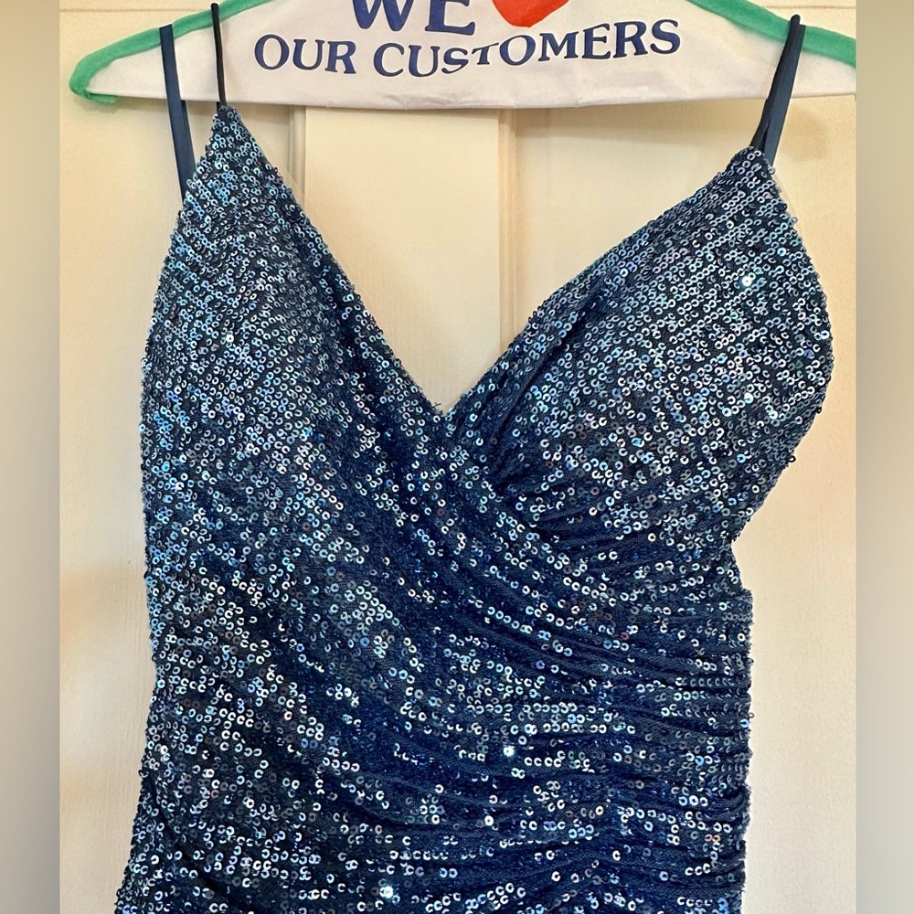 Only worn once. Cinderella Divine Blue sequin dress with open back and slit.